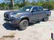 2021 Toyota Tacoma SR5 z VIN 5TFDZ5BN6MX059581, wystawiony jako IAAI lot #42051740 z przebiegiem 65 399 mil mil oraz . Historia ofert i sprzedaży dostępna na DreamBid. Obrazek 2.