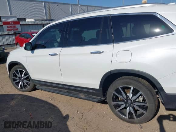 2022 Honda Pilot Touring 7-Passenger с VIN 5FNYF5H64NB027301, выставлен на аукционе IAAI как лот 41990473 с пробегом 21 510 миль миль и . История ставок и продаж доступна на DreamBid. Изображение 14.