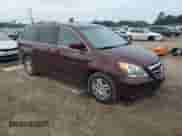 2007 Honda Odyssey EX-L z VIN 5FNRL38677B457411, wystawiony jako Copart lot #69689805 z przebiegiem 243 965 mil mil oraz Szkoda całkowita • Salvage title. Historia ofert i sprzedaży dostępna na DreamBid. Obrazek 4.