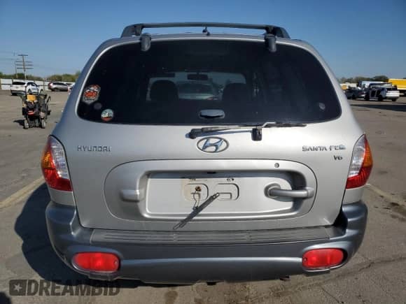 2004 Hyundai Santa Fe GLS z VIN KM8SC13D74U812202, wystawiony jako Copart lot #54954965 z przebiegiem 152 549 mil mil oraz Szkoda całkowita • Salvage title. Historia ofert i sprzedaży dostępna na DreamBid. Obrazek 6.