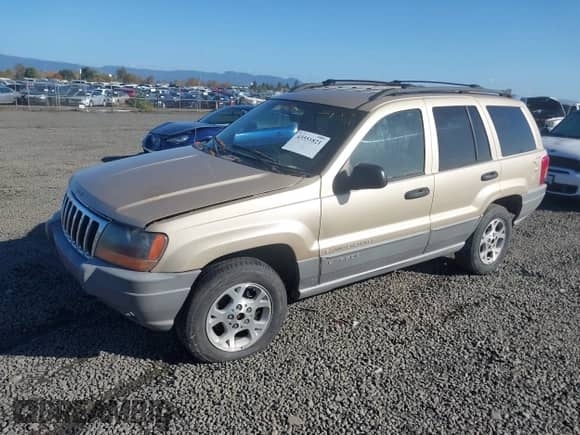 2000 Jeep Grand Cherokee Laredo z VIN 1J4GW48S0YC309210, wystawiony jako IAAI lot #43551821 z przebiegiem 324 070 mil mil oraz . Historia ofert i sprzedaży dostępna na DreamBid. Obrazek 2.