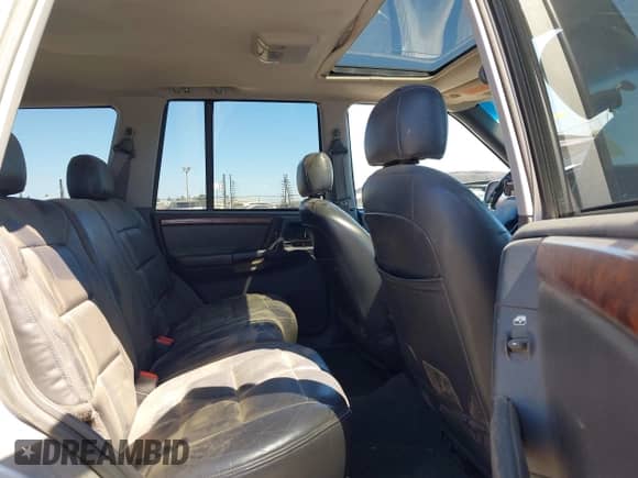 1998 Jeep Grand Cherokee Limited z VIN 1J4GZ78S1WC302742, wystawiony jako IAAI lot #43024107 z przebiegiem 155 196 mil mil oraz . Historia ofert i sprzedaży dostępna na DreamBid. Obrazek 8.