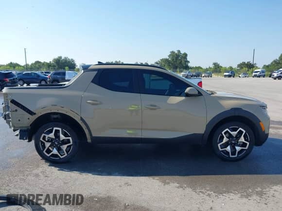 2023 Hyundai Santa Cruz Limited z VIN 5NTJEDAF6PH071136, wystawiony jako IAAI lot #42913930 z przebiegiem 33 057 mil mil oraz . Historia ofert i sprzedaży dostępna na DreamBid. Obrazek 14.
