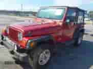 1999 Jeep Wrangler Sport z VIN 1J4FY19S3XP471780, wystawiony jako IAAI lot #43284989 z przebiegiem 170 884 mil mil oraz . Historia ofert i sprzedaży dostępna na DreamBid. Obrazek 2.