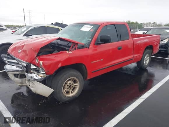 1999 Dodge Dakota SLT z VIN 1B7GL22X3XS155894, wystawiony jako IAAI lot #41938830 z przebiegiem 224 068 mil mil oraz . Historia ofert i sprzedaży dostępna na DreamBid. Obrazek 2.