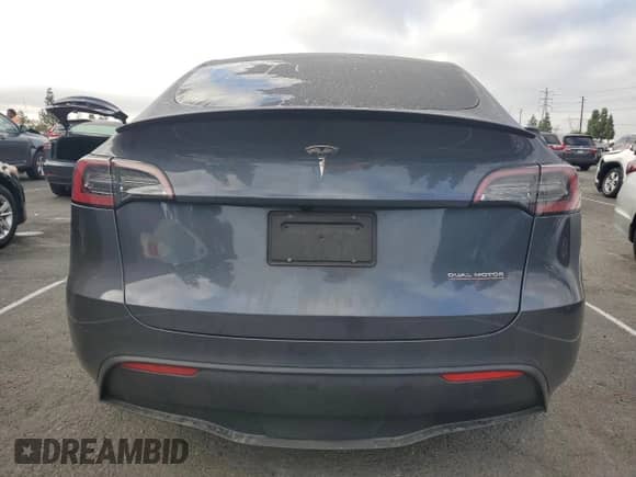 2023 Tesla Model Y Performance with VIN 7SAYGDEF7PF958571, listed as a Copart auction lot 84988605 with 40,428 mi miles and Salvage title. Bid and sale history available at DreamBid. Image 6.