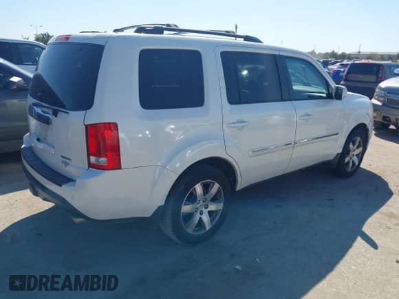 2014 Honda Pilot Touring with VIN 5FNYF3H95EB019027, listed as a IAAI auction lot 43424914 with 91,055 mi miles and . Bid and sale history available at DreamBid. Image 4.