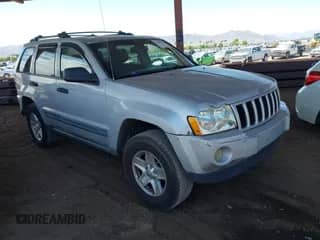 2005 Jeep Grand Cherokee Laredo with VIN 1J4HS48N65C563266, listed as a IAAI auction lot 42784524 with 156,702 mi miles and . Bid and sale history available at DreamBid. Image 1.