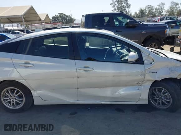 2016 Toyota Prius Four z VIN JTDKARFU2G3026287, wystawiony jako IAAI lot #42527258 z przebiegiem 50 149 mil mil oraz . Historia ofert i sprzedaży dostępna na DreamBid. Obrazek 13.