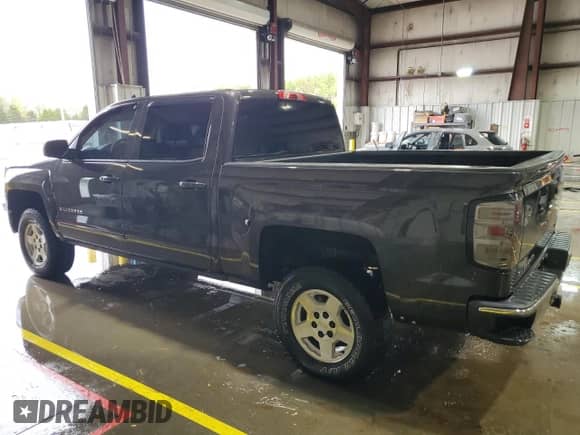 2015 Chevrolet Silverado 1500 LT with VIN 3GCUKREH3FG375593, listed as a Copart auction lot 54764715 with 128,675 mi miles and Salvage title. Bid and sale history available at DreamBid. Image 2.