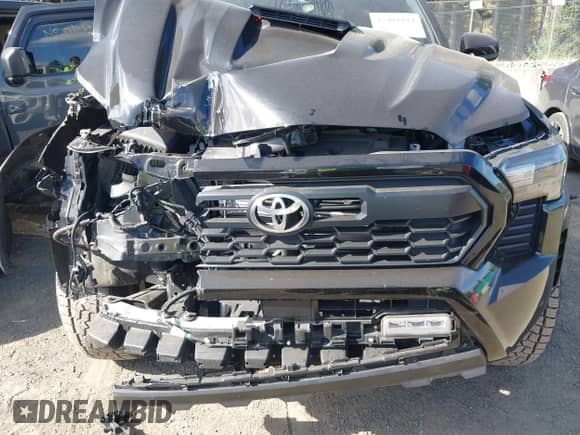 2024 Toyota Tacoma SR5 with VIN 3TMLB5JN4RM080833, listed as a IAAI auction lot 43404104 with 19,266 mi miles and . Bid and sale history available at DreamBid. Image 6.