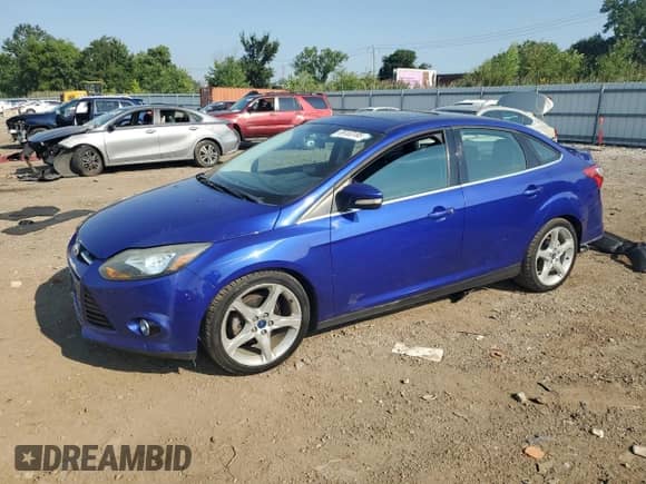 2013 Ford Focus Titanium with VIN 1FADP3J22DL113473, listed as a Copart auction lot 69153185 with 109,640 mi miles and Salvage title. Bid and sale history available at DreamBid. Image 1.
