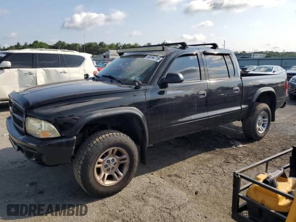 2003 Dodge Dakota Sport with VIN 1D7HG38XX3S334391, listed as a Copart auction lot 66194715 with 100,939 mi miles and Salvage title. Bid and sale history available at DreamBid. Image 1.