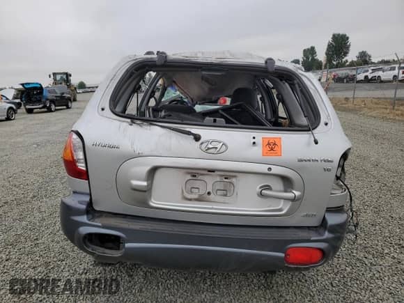 2003 Hyundai Santa Fe GLS с VIN KM8SC73D03U458797, выставлен на аукционе Copart как лот 69877294 с пробегом Не указан миль и Списание • Salvage title. История ставок и продаж доступна на DreamBid. Изображение 6.