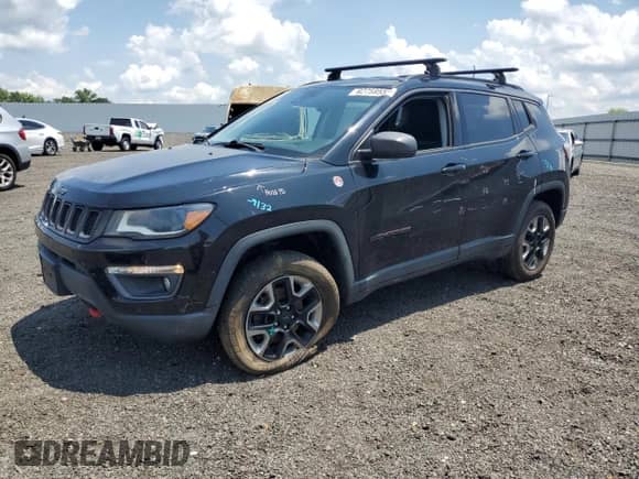 2017 Jeep Compass Trailhawk with VIN 3C4NJDDB6HT631761, listed as a Copart auction lot 62759555 with 94,528 mi miles and Salvage title. Bid and sale history available at DreamBid. Image 1.