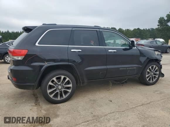 2017 Jeep Grand Cherokee Overland with VIN 1C4RJFCG8HC940430, listed as a Copart auction lot 68780995 with 150,371 mi miles and Salvage title. Bid and sale history available at DreamBid. Image 3.