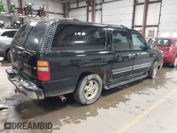 2002 Chevrolet Suburban Z71 with VIN 3GNFK16Z42G305930, listed as a IAAI auction lot 41002347 with 288,355 mi miles and . Bid and sale history available at DreamBid. Image 4.