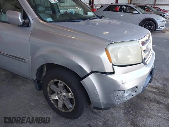 2009 Honda Pilot Touring with VIN 5FNYF48929B004092, listed as a IAAI auction lot 43116551 with 232,447 mi miles and . Bid and sale history available at DreamBid. Image 6.