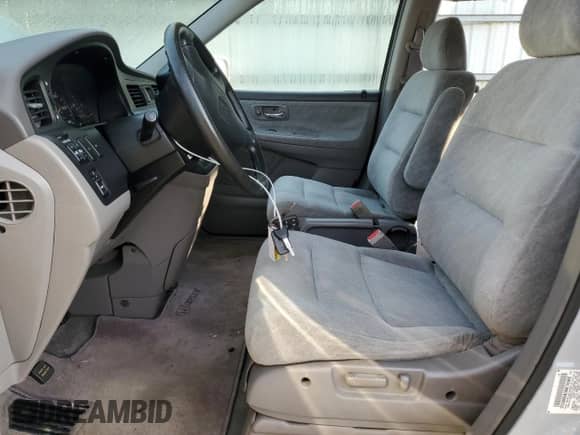2001 Honda Odyssey EX with VIN 2HKRL18601H566533, listed as a Copart auction lot 81707415 with 147,389 mi miles and Salvage title. Bid and sale history available at DreamBid. Image 7.
