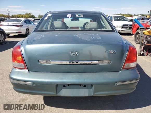 2002 Hyundai XG L z VIN KMHFU45E12A225689, wystawiony jako Copart lot #73006754 z przebiegiem 182 430 mil mil oraz Szkoda całkowita • Salvage title. Historia ofert i sprzedaży dostępna na DreamBid. Obrazek 6.