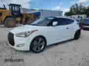 2014 Hyundai Veloster z VIN KMHTC6AD4EU194875, wystawiony jako Copart lot #84427235 z przebiegiem 127 813 mil mil oraz Szkoda całkowita • Salvage title. Historia ofert i sprzedaży dostępna na DreamBid. Obrazek 1.