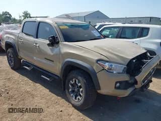 2018 Toyota Tacoma SR z VIN 3TMCZ5ANXJM126648, wystawiony jako IAAI lot #42581435 z przebiegiem 194 723 mil mil oraz . Historia ofert i sprzedaży dostępna na DreamBid. Obrazek 1.