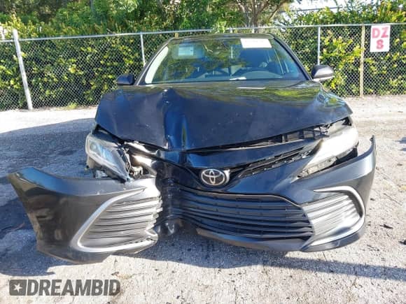 2021 Toyota Camry LE with VIN 4T1C11AK2MU472694, listed as a IAAI auction lot 43340745 with 61,965 mi miles and . Bid and sale history available at DreamBid. Image 6.