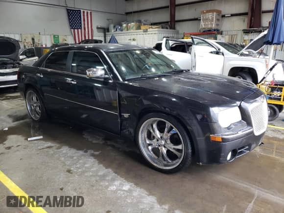 2005 Chrysler 300 C with VIN 2C3AA63H45H597778, listed as a Copart auction lot 83850975 with 128,599 mi miles and Salvage title. Bid and sale history available at DreamBid. Image 4.