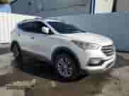 2017 Hyundai Santa Fe 2.0T with VIN 5XYZU4LA7HG497917, listed as a Copart auction lot 65240445 with 142,212 mi miles and Clean title. Bid and sale history available at DreamBid. Image 4.