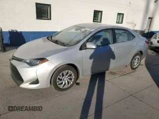 2019 Toyota Corolla L with VIN 5YFBURHE2KP907939, listed as a Copart auction lot 87214805 with 144,428 mi miles and Salvage title. Bid and sale history available at DreamBid. Image 1.