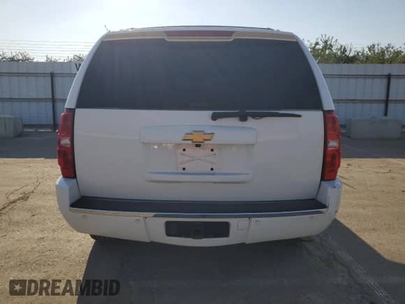 2013 Chevrolet Tahoe LTZ with VIN 1GNSKCE00DR315063, listed as a Copart auction lot 71993685 with 213,947 mi miles and Salvage title. Bid and sale history available at DreamBid. Image 6.