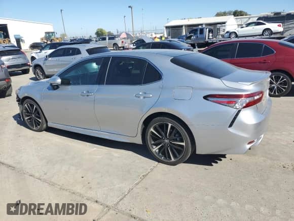 2018 Toyota Camry XSE с VIN 4T1B61HK5JU620397, выставлен на аукционе Copart как лот 86426265 с пробегом 50 459 миль миль и Списание • Salvage title. История ставок и продаж доступна на DreamBid. Изображение 2.