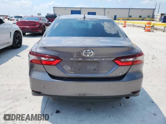 2021 Toyota Camry LE с VIN 4T1C11AK9MU587650, выставлен на аукционе Copart как лот 70694115 с пробегом 273 975 миль миль и Списание • Salvage title. История ставок и продаж доступна на DreamBid. Изображение 6.