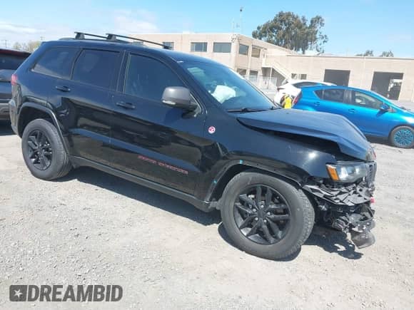 2020 Jeep Grand Cherokee Trailhawk with VIN 1C4RJFLG4LC118975, listed as a IAAI auction lot 41895950 with 106,638 mi miles and . Bid and sale history available at DreamBid. Image 1.