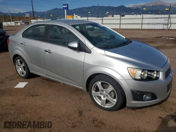 2015 Chevrolet Sonic LTZ with VIN 1G1JE5SB5F4130609, listed as a Copart auction lot 61953685 with 78,747 mi miles and Salvage title. Bid and sale history available at DreamBid. Image 4.