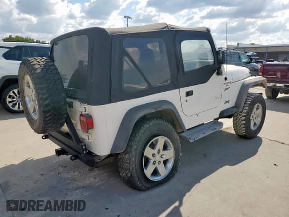 2001 Jeep Wrangler Sport с VIN 1J4FA49S01P305620, выставлен на аукционе Copart как лот 85516025 с пробегом Не указан миль и Списание • Salvage title. История ставок и продаж доступна на DreamBid. Изображение 3.