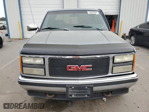1992 GMC Sierra 1500 z VIN 2GTEK19K1N1537823, wystawiony jako Copart lot #74952004 z przebiegiem 147 810 mil mil oraz Szkoda całkowita • Salvage title. Historia ofert i sprzedaży dostępna na DreamBid. Obrazek 5.