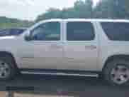 2013 Chevrolet Suburban LTZ with VIN 1GNSCKE0XDR322898, listed as a IAAI auction lot 42279704 with 213,429 mi miles and . Bid and sale history available at DreamBid. Image 14.