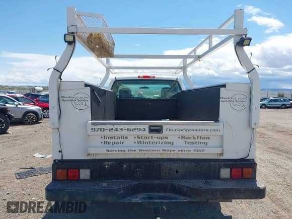 2005 Chevrolet Silverado 2500HD Work Truck with VIN 1GBHC24U55E285764, listed as a IAAI auction lot 42167919 with 113,960 mi miles and . Bid and sale history available at DreamBid. Image 16.