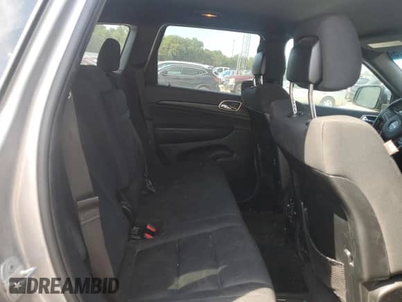 2014 Jeep Grand Cherokee Laredo with VIN 1C4RJEAGXEC573989, listed as a Copart auction lot 67977075 with 141,134 mi miles and Salvage title. Bid and sale history available at DreamBid. Image 11.