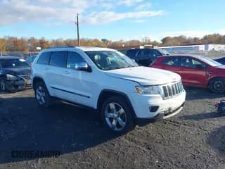 2013 Jeep Grand Cherokee Limited z VIN 1C4RJFBT1DC574710, wystawiony jako IAAI lot #43582984 z przebiegiem 211 876 mil mil oraz . Historia ofert i sprzedaży dostępna na DreamBid. Obrazek 1.