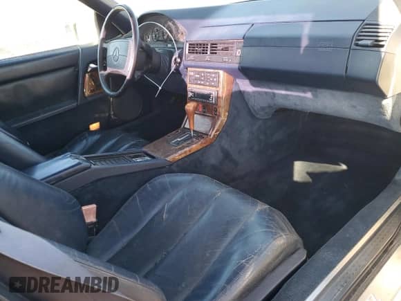 1990 Mercedes-Benz SL с VIN WDBFA61E1LF008533, выставлен на аукционе Copart как лот 80137904 с пробегом 121 430 миль миль и Чистый • Clean title. История ставок и продаж доступна на DreamBid. Изображение 8.