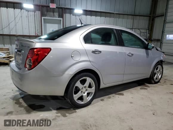 2013 Chevrolet Sonic LTZ with VIN 1G1JE5SH6D4102528, listed as a Copart auction lot 47419475 with 129,812 mi miles and Salvage title. Bid and sale history available at DreamBid. Image 3.