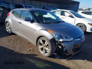 2017 Hyundai Veloster with VIN KMHTC6ADXHU323934, listed as a IAAI auction lot 41335240 with 99,008 mi miles and . Bid and sale history available at DreamBid. Image 1.