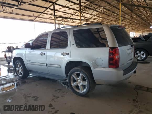 2014 Chevrolet Tahoe LT with VIN 1GNSCBE03ER110720, listed as a Copart auction lot 82323585 with 137,588 mi miles and Salvage title. Bid and sale history available at DreamBid. Image 2.