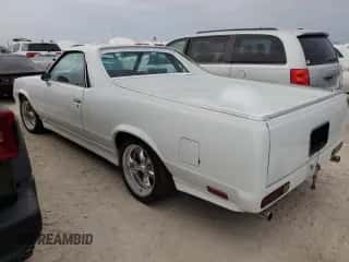 1984 Chevrolet El Camino с VIN 1GCCW80H7ER173291, выставлен на аукционе Copart как лот 76606244 с пробегом Не указан миль и Списание • Salvage title. История ставок и продаж доступна на DreamBid. Изображение 2.