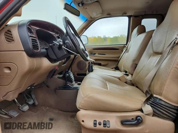 1999 Dodge 2500 with VIN 3B7KF2369XG110957, listed as a Copart auction lot 82387765 with 221,505 mi miles and Salvage title. Bid and sale history available at DreamBid. Image 7.