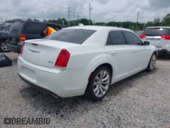 2016 Chrysler 300 Anniversary Edition with VIN 2C3CCAAG2GH343828, listed as a IAAI auction lot 42291353 with 126,336 mi miles and . Bid and sale history available at DreamBid. Image 4.