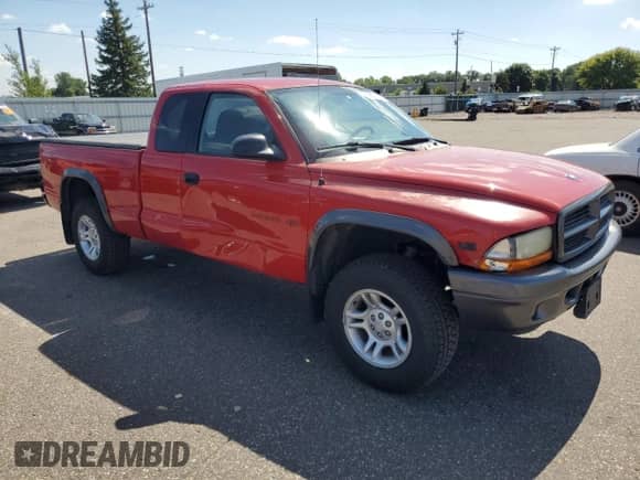 2002 Dodge Dakota with VIN 1B7GG12X02S543317, listed as a Copart auction lot 68133955 with 128,938 mi miles and Salvage title. Bid and sale history available at DreamBid. Image 4.