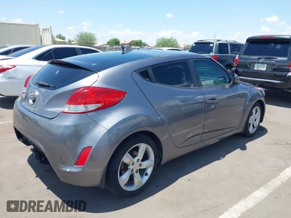 2015 Hyundai Veloster with VIN KMHTC6AD6FU239445, listed as a IAAI auction lot 42757675 with 114,509 mi miles and . Bid and sale history available at DreamBid. Image 4.